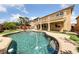 Refreshing backyard pool surrounded by well-maintained landscaping, ideal for relaxation and recreation at 8547 Benidorm Ave, Las Vegas, NV 89178