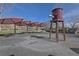 Community splash pad with overhead water features and covered picnic tables, great for hot days at 8547 Benidorm Ave, Las Vegas, NV 89178