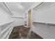 Organized walk-in closet with shelving units and hanging rods for optimal storage solutions at 8547 Benidorm Ave, Las Vegas, NV 89178