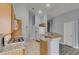 Bright kitchen with updated appliances, granite countertops and ample cabinet space at 8675 Traveling Breeze Ave # 101, Las Vegas, NV 89178