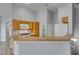 Stylish kitchen with light wood cabinetry, stainless steel appliances and granite countertops at 8675 Traveling Breeze Ave # 101, Las Vegas, NV 89178