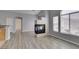 Spacious living area with corner fireplace and large window allowing plenty of natural light at 8675 Traveling Breeze Ave # 101, Las Vegas, NV 89178