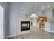 Living room with fireplace, wood-look floors and natural light at 8675 Traveling Breeze Ave # 101, Las Vegas, NV 89178