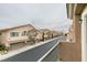 Charming townhomes lining a well-maintained street with attached garages and landscaped front yards in a quiet community at 8675 Traveling Breeze Ave # 101, Las Vegas, NV 89178