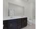 Bright bathroom featuring a double sink vanity with dark cabinets, white countertop and fixtures at 888 Cherry Glen Pl, Las Vegas, NV 89138