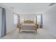 Spacious bedroom featuring a wooden bed frame with plush carpeting and ample natural light at 888 Cherry Glen Pl, Las Vegas, NV 89138