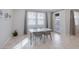 Dining area with a glass table, chairs, and a door that leads to the backyard at 888 Cherry Glen Pl, Las Vegas, NV 89138
