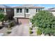 Charming two-story home featuring a well-maintained yard and a brick-paved driveway leading to a two-car garage at 888 Cherry Glen Pl, Las Vegas, NV 89138