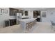 Elegant kitchen boasts a large island with seating, stainless steel appliances, and dark wood cabinets at 888 Cherry Glen Pl, Las Vegas, NV 89138