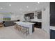 Open-concept kitchen with a large island, seating, stainless steel appliances, and a seamless transition to the living area at 888 Cherry Glen Pl, Las Vegas, NV 89138