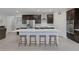 Modern kitchen featuring a large center island with seating, stainless steel appliances, and ample countertop space at 888 Cherry Glen Pl, Las Vegas, NV 89138