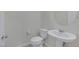 Neat powder room features a pedestal sink, toilet, and chrome fixtures at 888 Cherry Glen Pl, Las Vegas, NV 89138