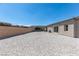 Spacious backyard featuring desert landscaping, brick patio and barbecue area at 8929 Cassia Winds St, Las Vegas, NV 89166