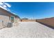 Large, low-maintenance backyard featuring desert landscaping and brick patio at 8929 Cassia Winds St, Las Vegas, NV 89166