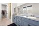 Bathroom featuring double sinks, granite countertop and walk-in shower at 8929 Cassia Winds St, Las Vegas, NV 89166