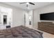 Bright bedroom features a modern aesthetic, leading to ensuite and bathroom at 8929 Cassia Winds St, Las Vegas, NV 89166