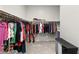 Walk-in closet with multiple hanging rods and ample clothing storage at 8929 Cassia Winds St, Las Vegas, NV 89166