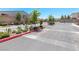 Gated community entrance with well-maintained landscaping and signage at 8929 Cassia Winds St, Las Vegas, NV 89166