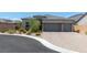 Beautiful single-story home with a two-car garage and a well-manicured front yard at 8929 Cassia Winds St, Las Vegas, NV 89166