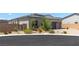 Charming home featuring desert landscaping and privacy wall at 8929 Cassia Winds St, Las Vegas, NV 89166