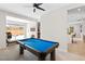Spacious game room featuring a pool table and view of the backyard at 8929 Cassia Winds St, Las Vegas, NV 89166