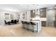 Open kitchen and dining area with modern island and stylish pendant lighting at 8929 Cassia Winds St, Las Vegas, NV 89166