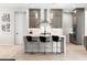Gourmet kitchen with white countertops and sleek, modern black bar stools at 8929 Cassia Winds St, Las Vegas, NV 89166