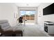 Bright home office with a sliding glass door, modern furniture, neutral walls, and plenty of natural light at 8929 Cassia Winds St, Las Vegas, NV 89166