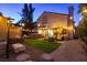 Lush backyard featuring a hot tub, seating area, and well-manicured lawn, perfect for relaxation at 9013 Cypress Point Way, Las Vegas, NV 89117