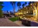 Inviting backyard with seating area, spa and covered pergola with beautiful decorative lighting at 9013 Cypress Point Way, Las Vegas, NV 89117