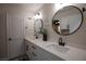 Modern bathroom featuring double sinks, white countertops, and matte black hardware at 9013 Cypress Point Way, Las Vegas, NV 89117