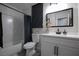 Bathroom with white tile surround tub and shower, and a single sink vanity at 9013 Cypress Point Way, Las Vegas, NV 89117