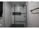 Beautifully tiled shower featuring glass door and niche for supplies at 9013 Cypress Point Way, Las Vegas, NV 89117
