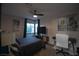 Bedroom featuring large window, television and desk/office area at 9013 Cypress Point Way, Las Vegas, NV 89117