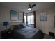 Bedroom featuring picture window, two bedside tables and art at 9013 Cypress Point Way, Las Vegas, NV 89117