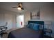 Cozy bedroom with carpet, ceiling fan and well decorated in blue, gray and white tones at 9013 Cypress Point Way, Las Vegas, NV 89117