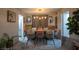 Elegant dining room featuring stylish decor, a modern chandelier, and seating for eight guests at 9013 Cypress Point Way, Las Vegas, NV 89117