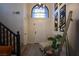 Bright entryway features a chair, decor, and staircase leading to the second floor at 9013 Cypress Point Way, Las Vegas, NV 89117
