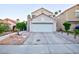 Charming two-story home with a well-maintained front yard, a two car garage and desert landscaping at 9013 Cypress Point Way, Las Vegas, NV 89117