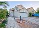 Charming two-story home with a well-maintained lawn, mature trees, and a spacious two-car garage at 9013 Cypress Point Way, Las Vegas, NV 89117