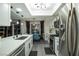 Contemporary kitchen with stainless steel appliances, a breakfast bar and dining area at 9013 Cypress Point Way, Las Vegas, NV 89117