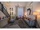 Bright living room with modern decor, comfortable seating, high ceilings, and stylish lighting at 9013 Cypress Point Way, Las Vegas, NV 89117