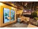 Cozy covered patio with comfortable seating, string lights, and access to the home's interior at 9013 Cypress Point Way, Las Vegas, NV 89117