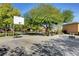Community basketball court surrounded by mature shade trees for a fun outdoor game and recreation at 9065 Adorable Ave, Las Vegas, NV 89149