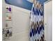 Clean bathroom featuring a bathtub with a shower and a stylish patterned shower curtain and shelf at 9065 Adorable Ave, Las Vegas, NV 89149