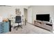 This bedroom features neutral walls and carpet, complemented by a television and desk at 9065 Adorable Ave, Las Vegas, NV 89149