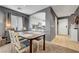 Dining area with seating for four and kitchen view at 9065 Adorable Ave, Las Vegas, NV 89149
