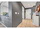 Entryway featuring tile flooring, white door, and view into kitchen at 9065 Adorable Ave, Las Vegas, NV 89149