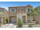 Charming two-story home featuring desert landscaping, a private entry porch, and an attached one car garage at 9065 Adorable Ave, Las Vegas, NV 89149