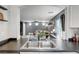 Kitchen sink featuring stainless steel faucet and view to living room at 9065 Adorable Ave, Las Vegas, NV 89149